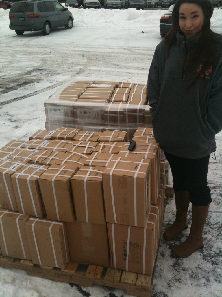 NicoleDuCaneKBsFleece Nicole DuCane with pallet of kettlebells and Dragon Door fleece